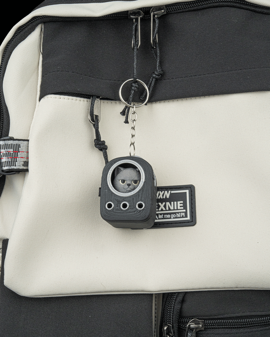 Everyday Pack British Shorthair keychain attached to a stylish everyday carry pack.